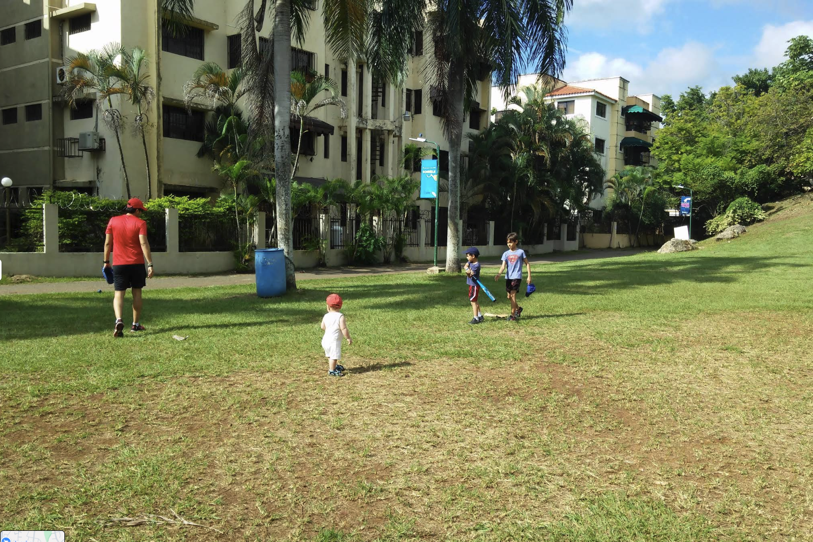 Families enjoying Las Praderas Park near the apartment buildings