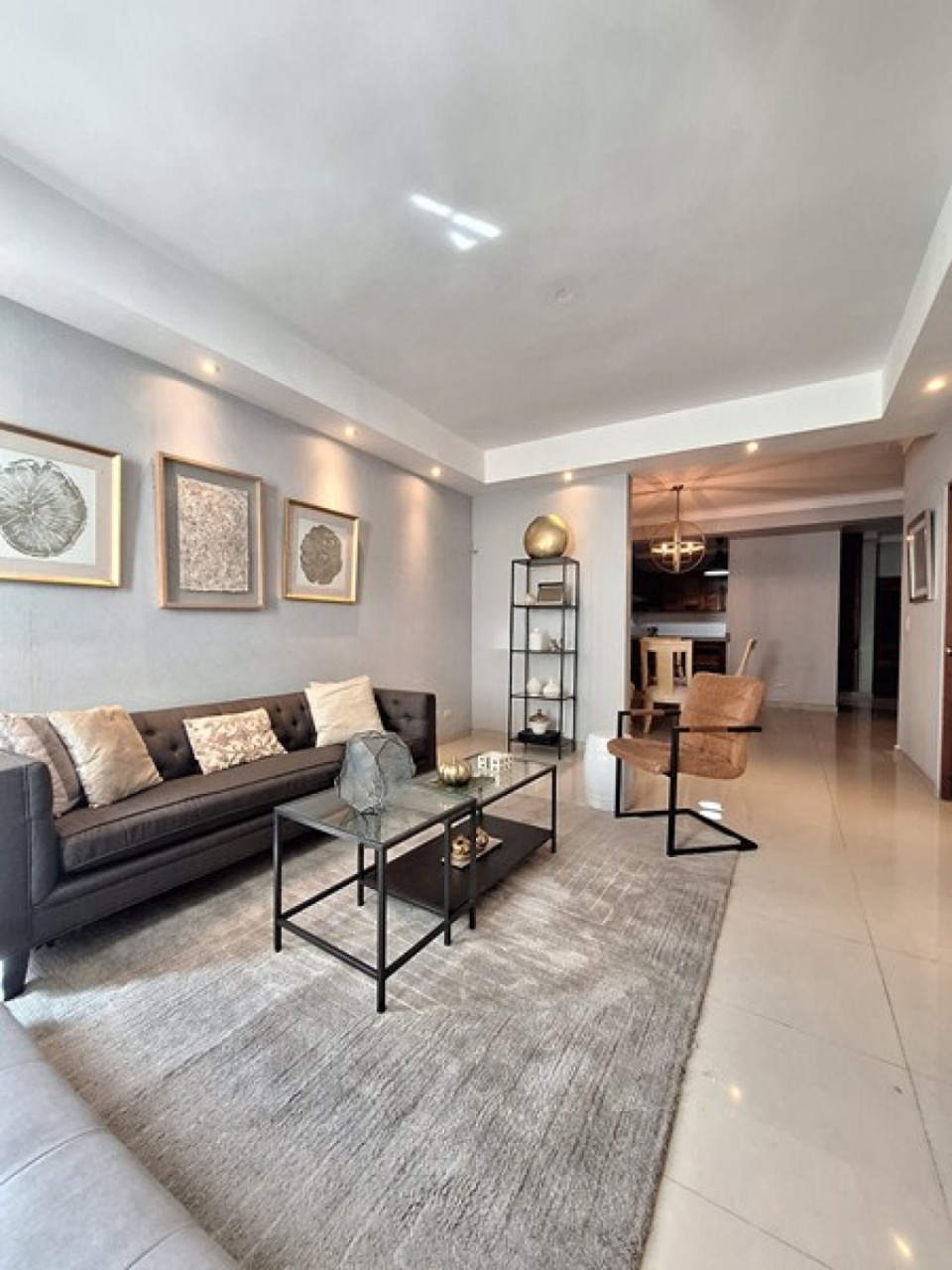 Living room with modern furniture and recessed lighting