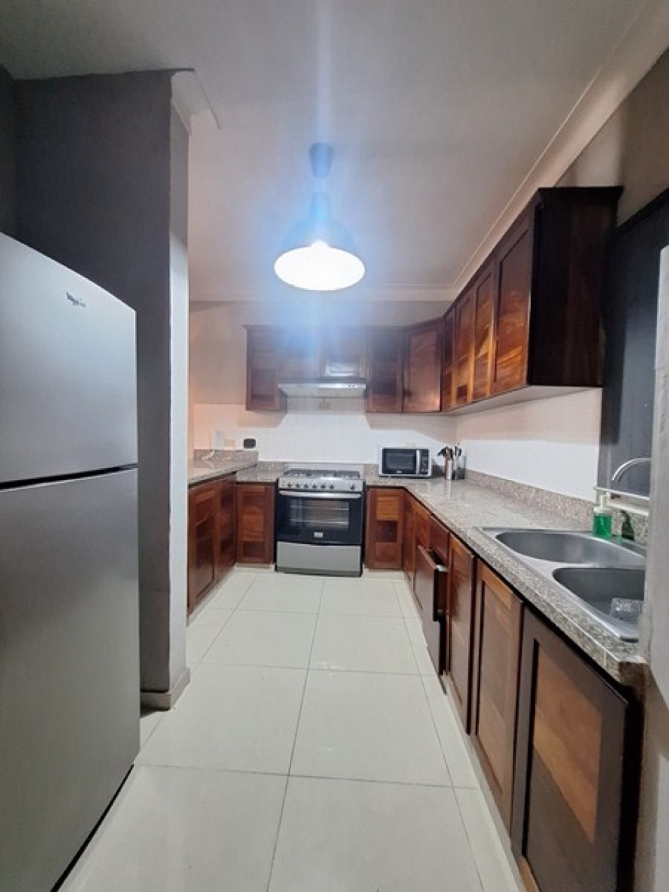 Kitchen with mahogany cabinets and stainless appliances